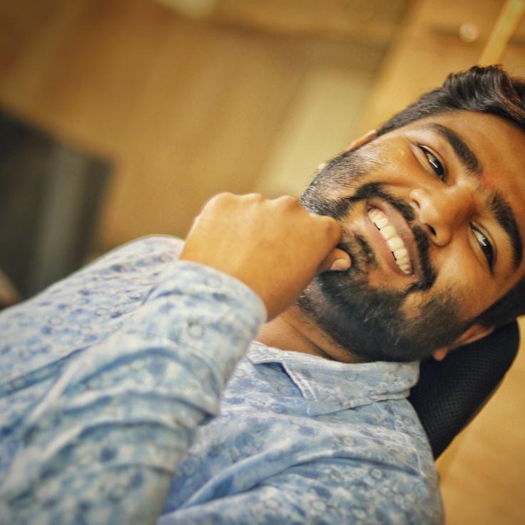 Kaveri Mehta, Lead Design Curator at SummitGrainLoft, reviewing corporate floral arrangements